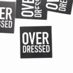 XL Label "OVER DRESSED"